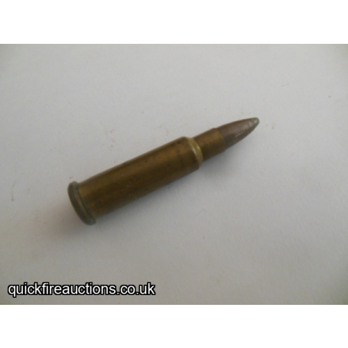 One inert .218 Mashburn Bee long neck wildcat cartridge