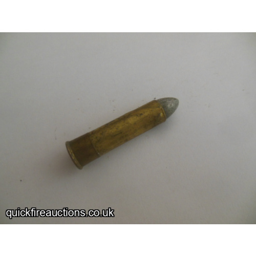 One inert Purdey 1 1/2" rolled brass cartridge