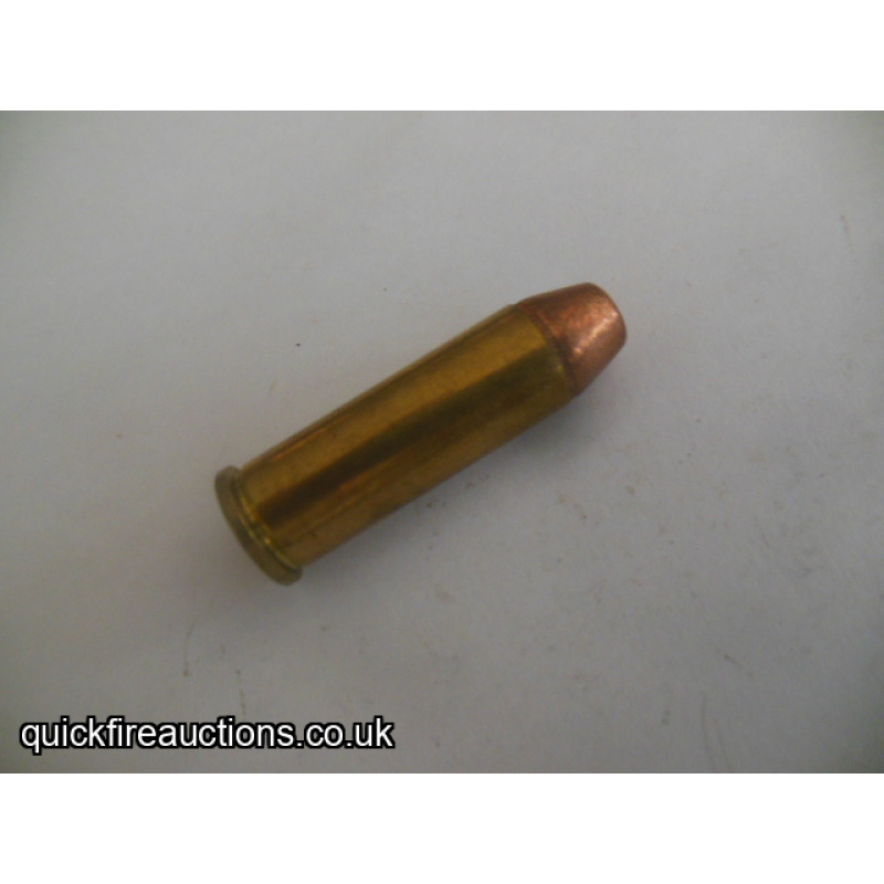 One inert Yugoslav 44 Remington magnum cartridge