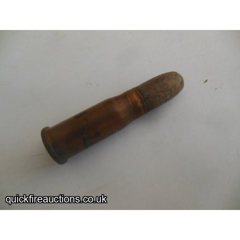 One inert Swiss 10.4 x 38R wood blank  rimfire cartridge