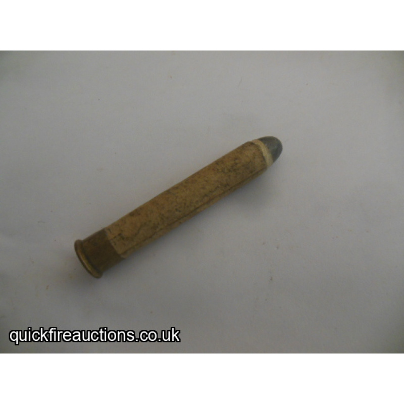 One inert Eley 360 2 1/4" card case cartridge