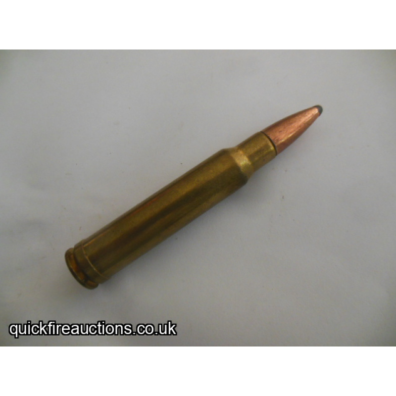 One inert Federal 338 Winchester magnum cartridge