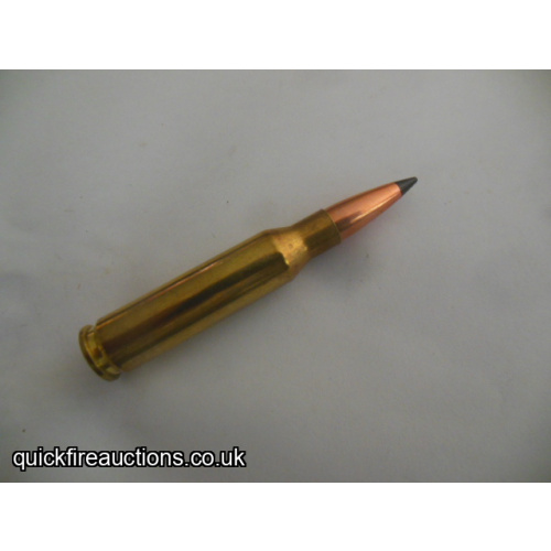 One inert R_P 7mm-08 Remington ballistic tip cartridge