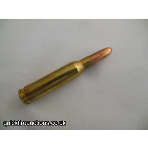 One inert R_P 7mm-08 Remington cartridge