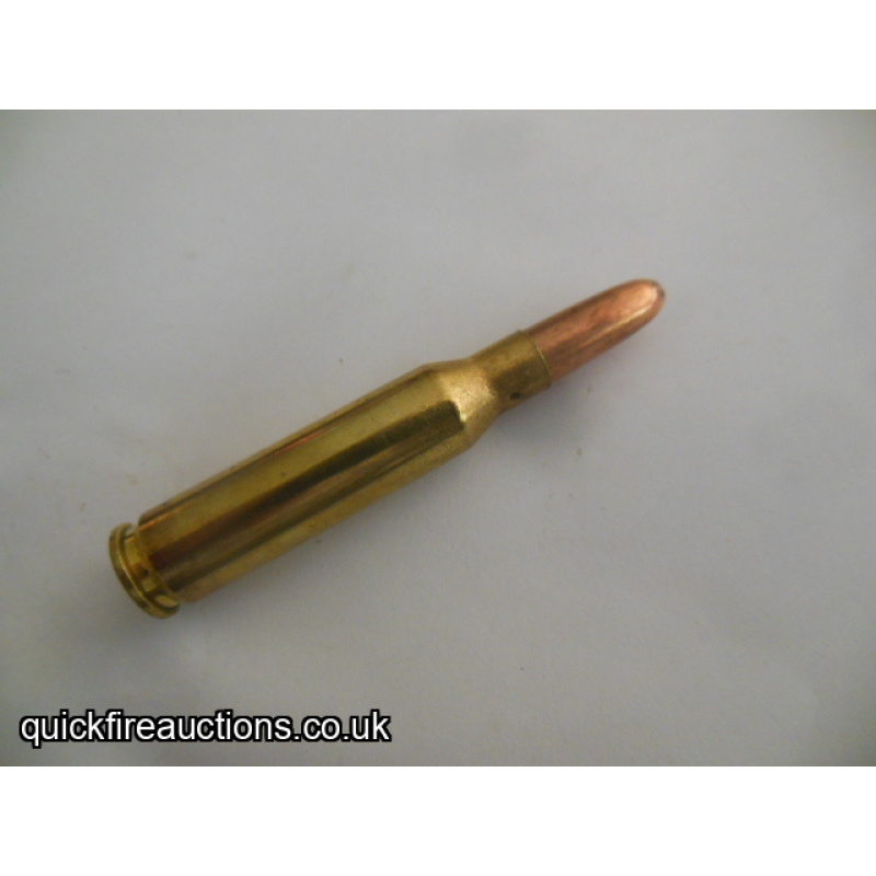 One inert R_P 7mm-08 Remington cartridge
