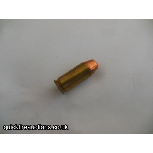One inert 451 Detonics magnum cartridge