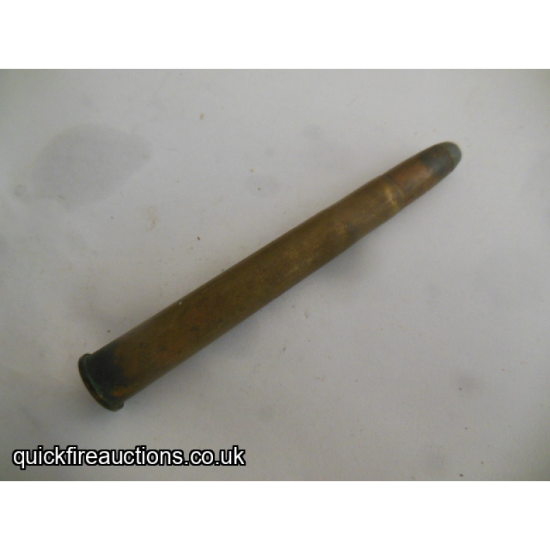One inert German 9.3 x 74R cartridge