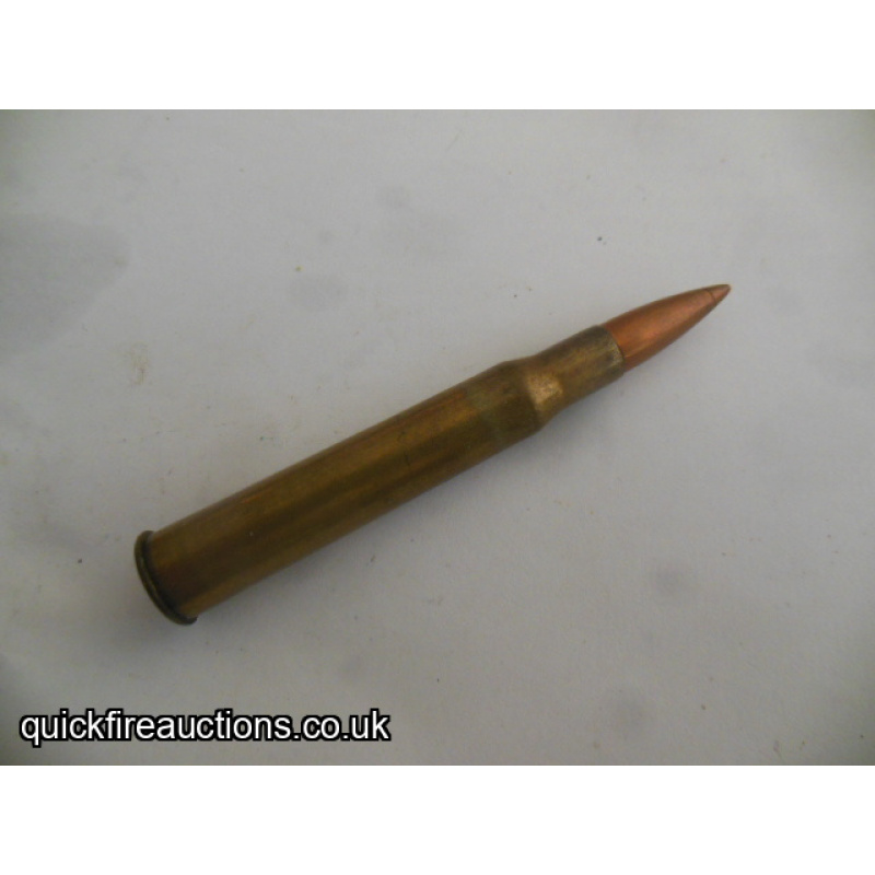 One inert Hollands 7mm magnum flanged cartridge