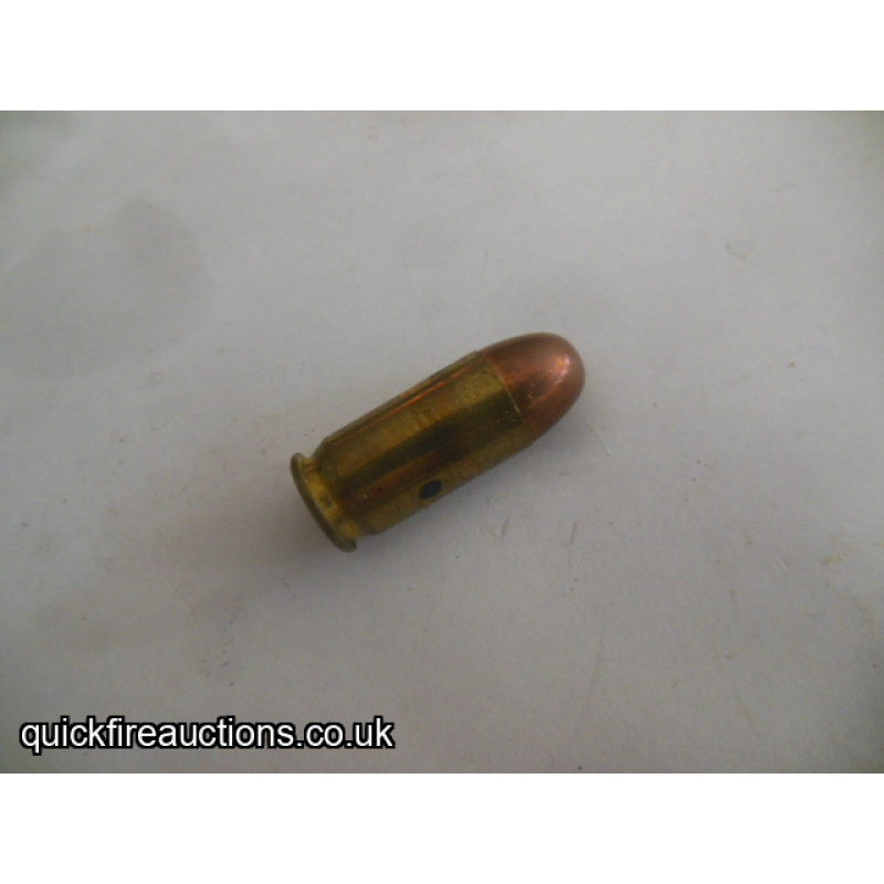One inert R-P 45 auto cartridge