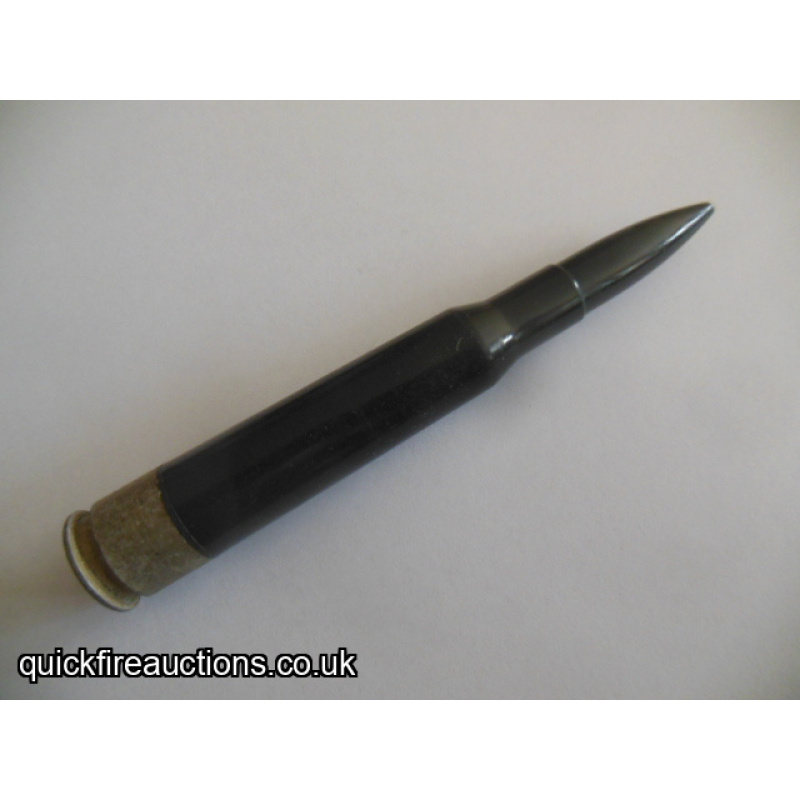 One inert East German black plastic 12.7 drill/dummy cartridge